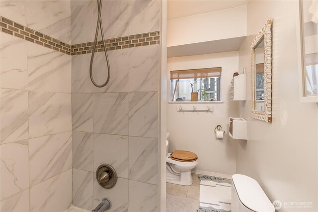 full bath with toilet, shower / bath combination, and tile patterned floors