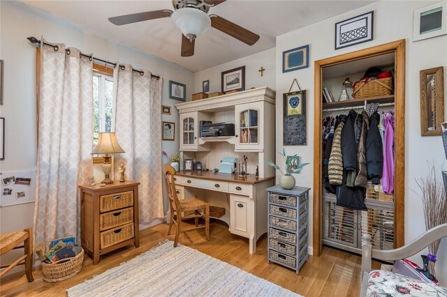 office space featuring ceiling fan and light wood finished floors