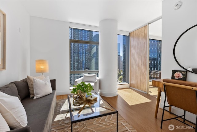 820 Blanchard St Unit 1507, Seattle, WA 98121 - living area with a city view, floor to ceiling windows, and wood finished floors