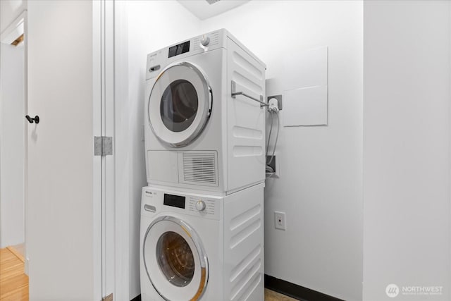 820 Blanchard St Unit 1507, Seattle, WA 98121 - laundry room featuring stacked washing maching and dryer and laundry area