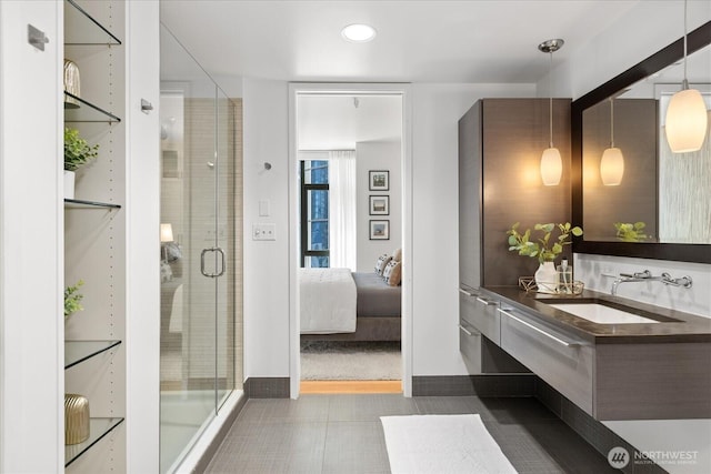 820 Blanchard St Unit 1507, Seattle, WA 98121 - ensuite bathroom with tile patterned flooring, vanity, baseboards, a shower stall, and ensuite bathroom