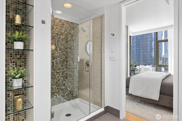 820 Blanchard St Unit 1507, Seattle, WA 98121 - full bathroom featuring baseboards, connected bathroom, and a shower stall