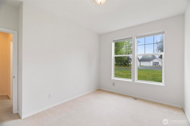 823 Landing Way, Centralia, WA 98531 - unfurnished room with baseboards, light colored carpet, and visible vents