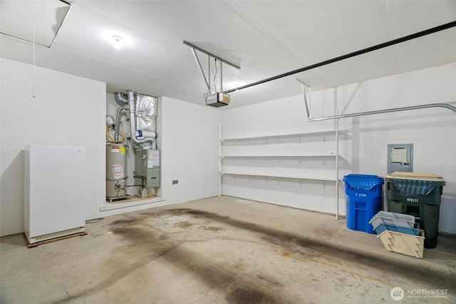 823 Landing Way, Centralia, WA 98531 - garage featuring heating unit, a garage door opener, and water heater