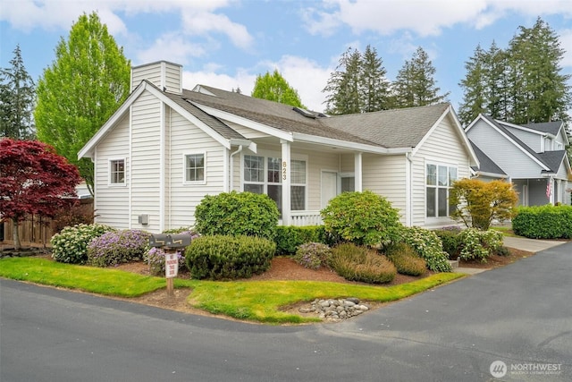 823 Landing Way, Centralia, WA 98531 - view of side of home with roof with shingles and a chimney