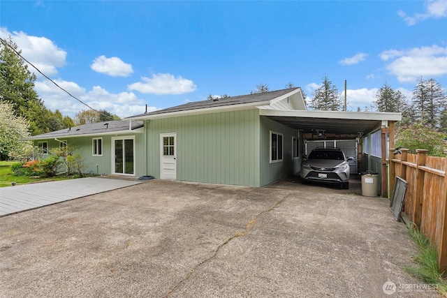 16 Harrison St, South Bend, WA 98586 - view of side of property with concrete driveway, fence, and a carport