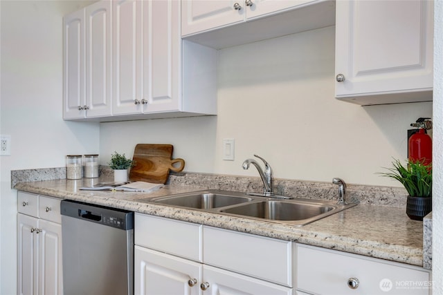 1156 Alki Ave SW Unit 105, Seattle, WA 98116 - kitchen featuring stainless steel dishwasher, white cabinetry, a sink, and light countertops