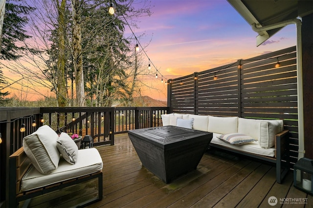 3679 Silver Oak Ct, Bellingham, WA 98226 - deck at dusk with an outdoor living space