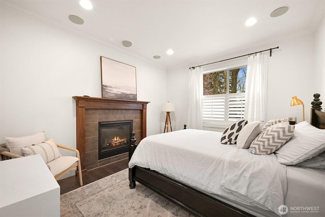 3679 Silver Oak Ct, Bellingham, WA 98226 - bedroom featuring ornamental molding, a fireplace, recessed lighting, and wood finished floors