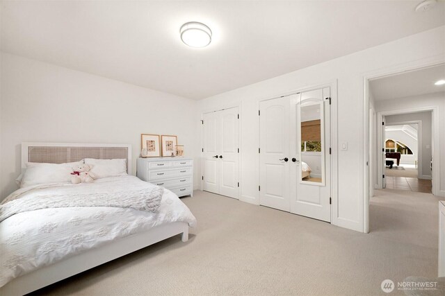 3679 Silver Oak Ct, Bellingham, WA 98226 - bedroom featuring light colored carpet and two closets