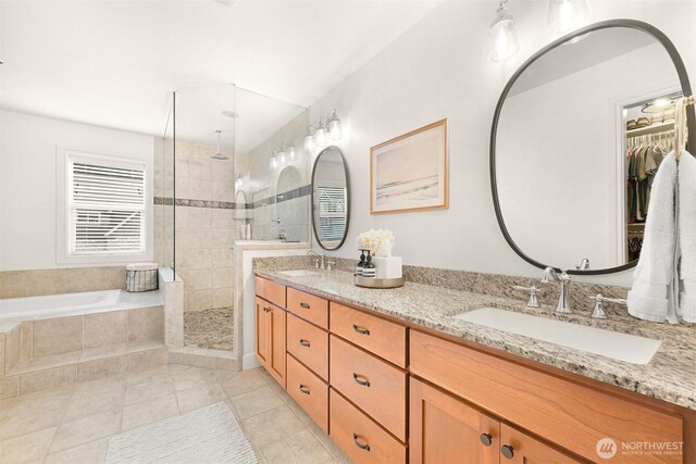 3679 Silver Oak Ct, Bellingham, WA 98226 - bathroom featuring a sink, a walk in shower, a garden tub, and tile patterned floors