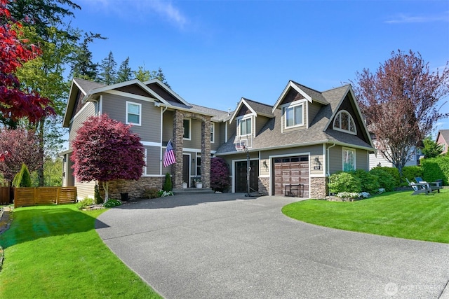 3679 Silver Oak Ct, Bellingham, WA 98226 - view of front of property with fence, roof with shingles, stone siding, a front yard, and driveway