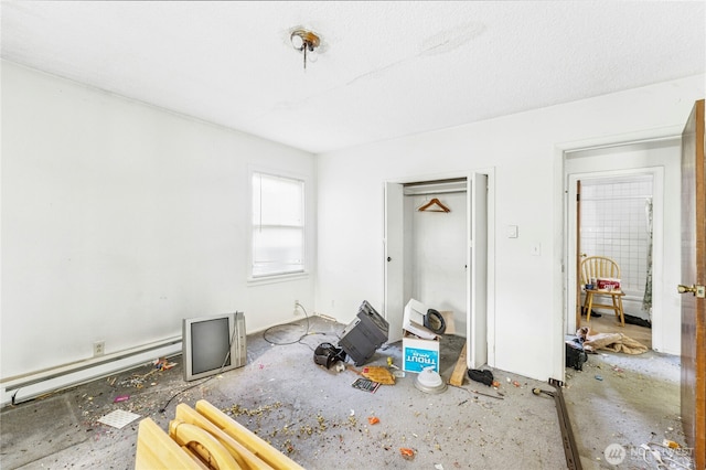 99 Sumner Ave, Sumner, WA 98390 - unfurnished bedroom featuring a baseboard radiator