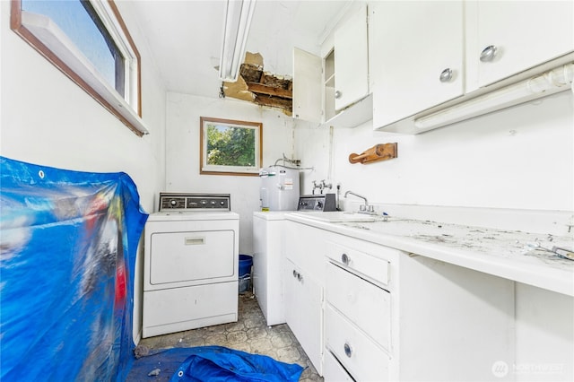 99 Sumner Ave, Sumner, WA 98390 - washroom featuring a sink, washer and clothes dryer, cabinet space, and water heater