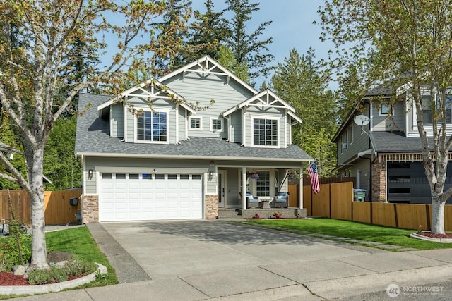 craftsman house with fence, an attached garage, a porch, and driveway