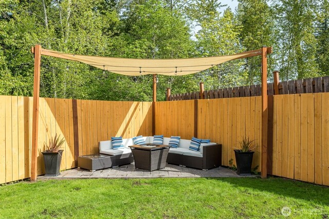 view of yard with a fenced backyard and an outdoor hangout area
