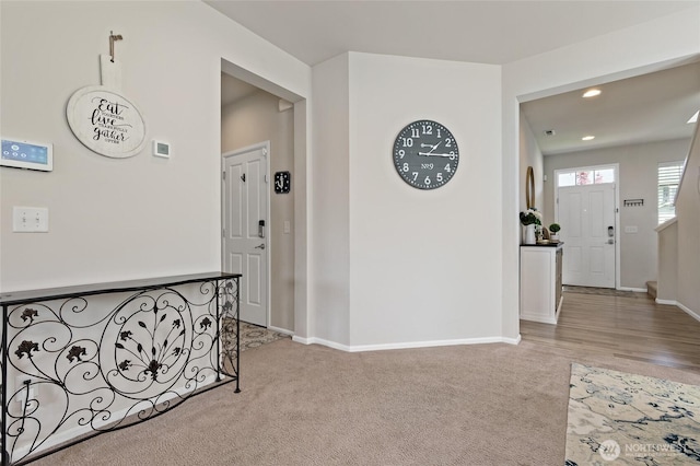 hall with baseboards, carpet, and recessed lighting