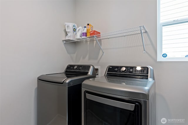 washroom with laundry area and washing machine and clothes dryer