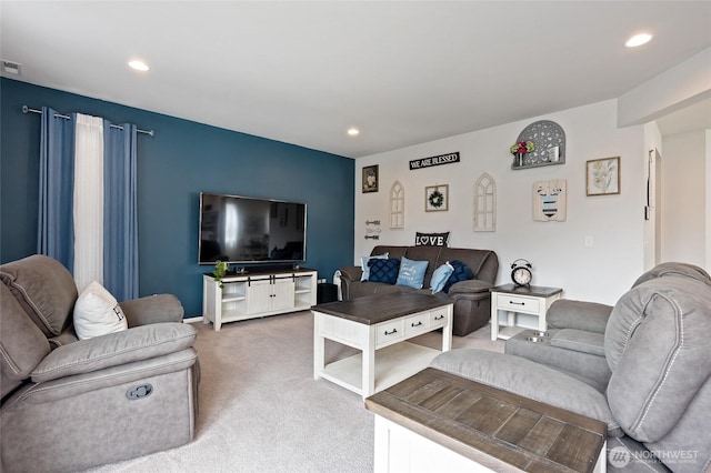 carpeted living area with recessed lighting