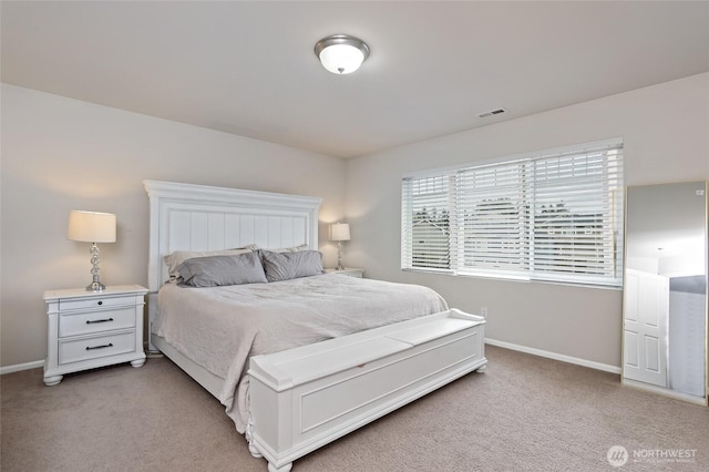 bedroom featuring baseboards, visible vents, and light carpet