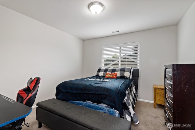 bedroom featuring carpet floors, baseboards, and visible vents