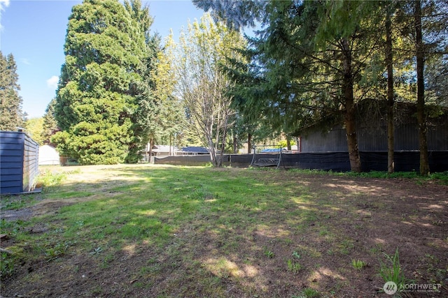 view of yard with fence