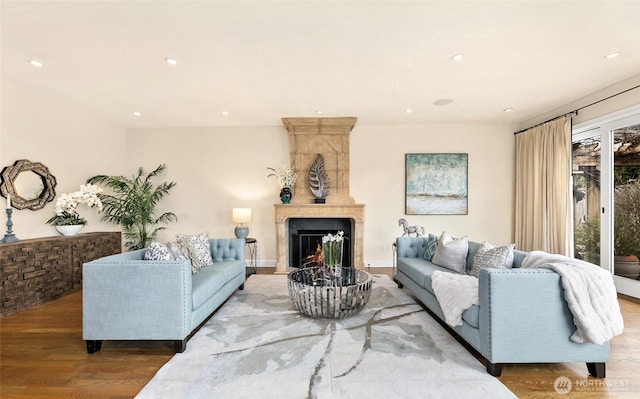9676 Evergreen Dr, Bellevue, WA 98004 - living area with wood finished floors, recessed lighting, and a large fireplace