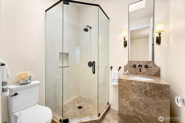 9676 Evergreen Dr, Bellevue, WA 98004 - bathroom featuring a sink, a shower stall, and toilet