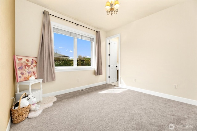 9676 Evergreen Dr, Bellevue, WA 98004 - carpeted spare room featuring baseboards and a chandelier