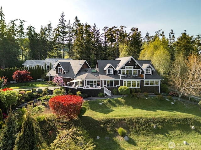 15089 Old Deception Mill Ln, Anacortes, WA 98221 - rear view of property featuring a lawn and a balcony