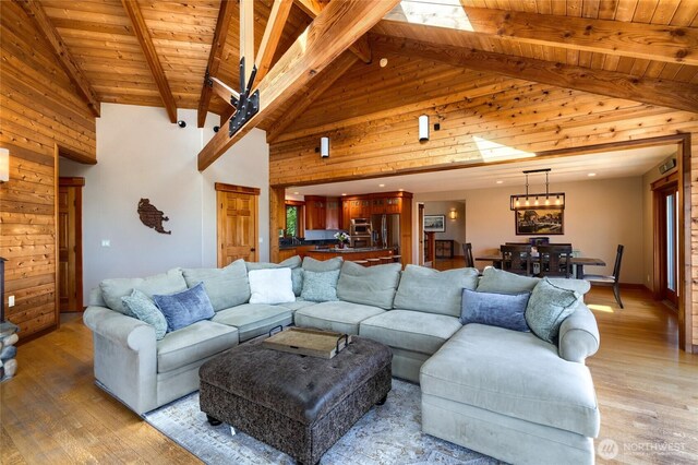 15089 Old Deception Mill Ln, Anacortes, WA 98221 - living area featuring wood ceiling, high vaulted ceiling, beam ceiling, and light wood-style floors
