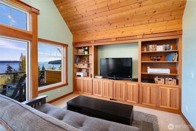 15089 Old Deception Mill Ln, Anacortes, WA 98221 - carpeted living room with baseboards, vaulted ceiling, and a wealth of natural light
