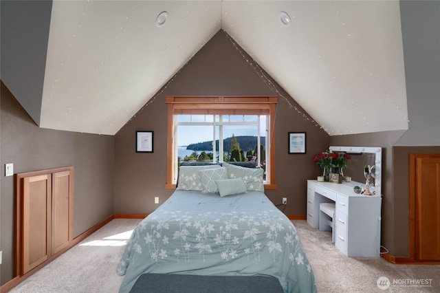 15089 Old Deception Mill Ln, Anacortes, WA 98221 - bedroom featuring a mountain view, vaulted ceiling, and light carpet