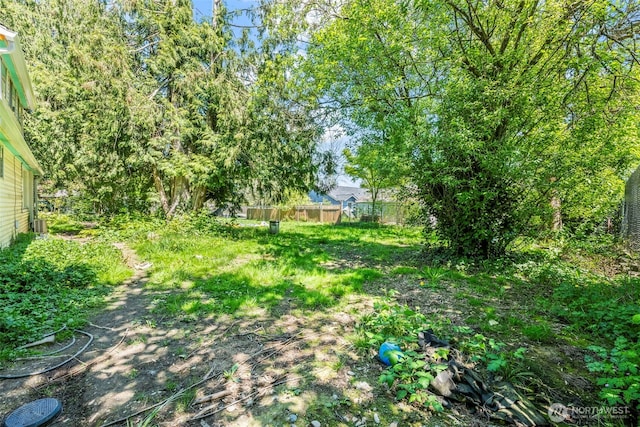 view of yard featuring fence