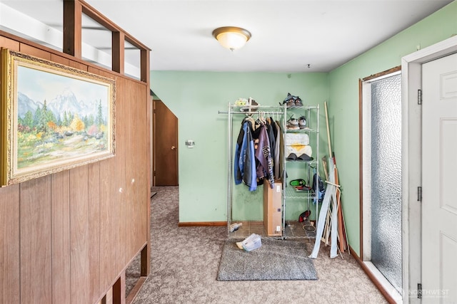 mudroom featuring carpet floors and baseboards