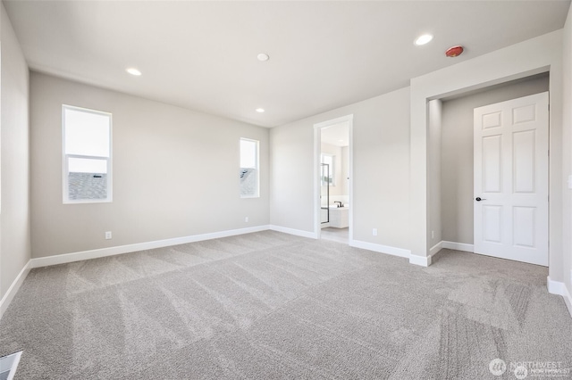 unfurnished room with baseboards, carpet flooring, and recessed lighting