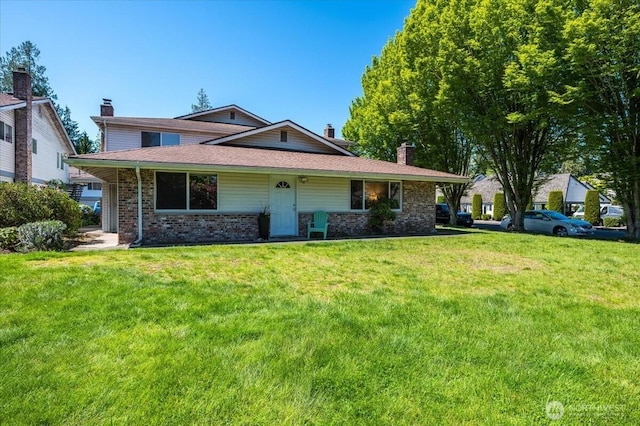 4502 216th St SW Unit A, Mountlake Terrace, WA 98043 - view of front of house with a chimney, brick siding, and a front yard