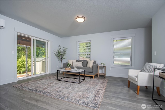 206 Oak St, Winlock, WA 98596 - living room with wood finished floors, baseboards, and a textured ceiling
