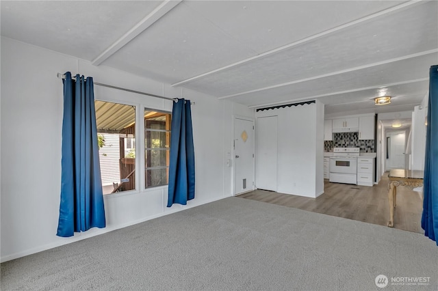 unfurnished living room with carpet floors