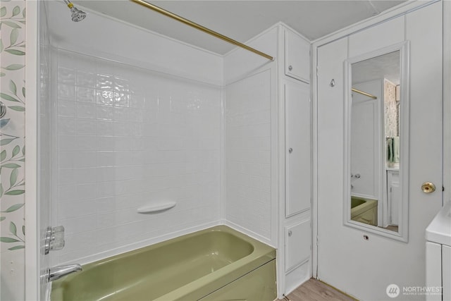 bathroom with shower / bath combo with shower curtain and wood finished floors