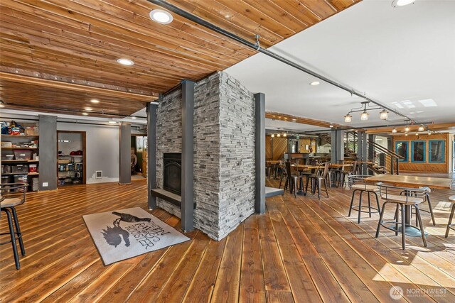 27510 Hwy 97, Cle Elum, WA 98922 - living area with recessed lighting, visible vents, wood-type flooring, wood ceiling, and a fireplace