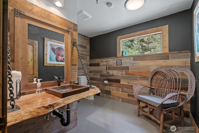 27510 Hwy 97, Cle Elum, WA 98922 - sitting room featuring wooden walls and finished concrete floors