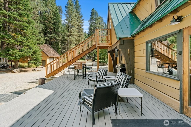 27510 Hwy 97, Cle Elum, WA 98922 - wooden deck featuring stairway and outdoor dining area