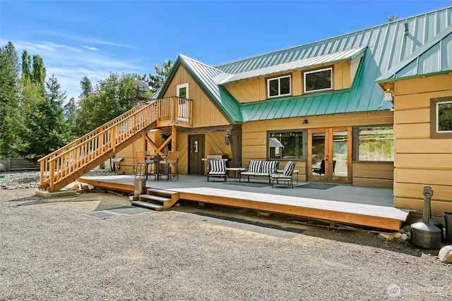 27510 Hwy 97, Cle Elum, WA 98922 - rear view of property with a deck, a standing seam roof, and french doors