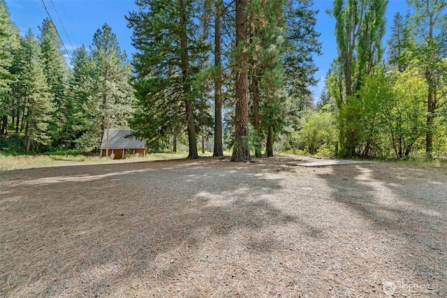 27510 Hwy 97, Cle Elum, WA 98922 - exterior space with a wooded view and an outbuilding