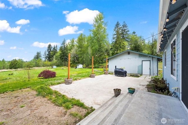 view of patio / terrace featuring an outbuilding