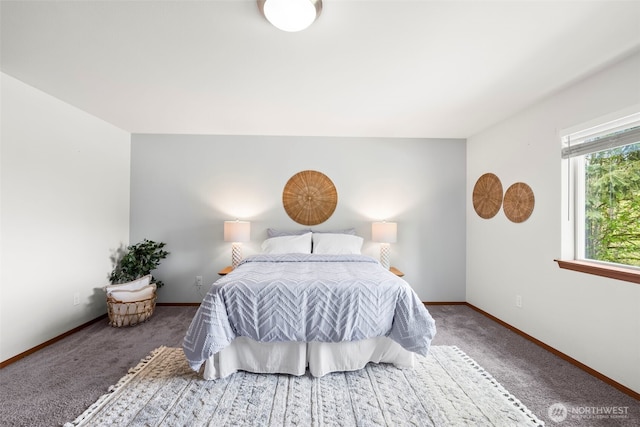 bedroom featuring carpet floors and baseboards