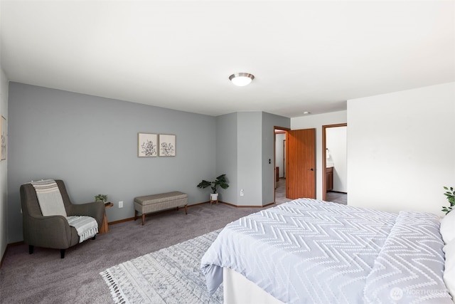 bedroom with carpet floors and baseboards