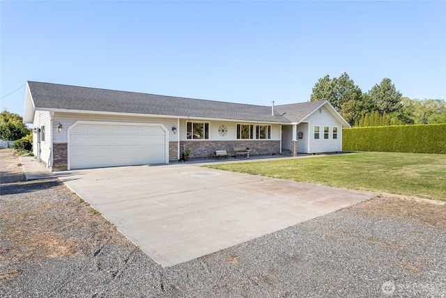 2710 Willowdale Rd, Ellensburg, WA 98926 - ranch-style house featuring concrete driveway, an attached garage, and a front yard