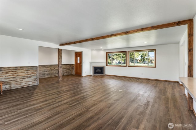 2710 Willowdale Rd, Ellensburg, WA 98926 - unfurnished living room featuring a fireplace, dark wood-style flooring, beamed ceiling, wainscoting, and recessed lighting